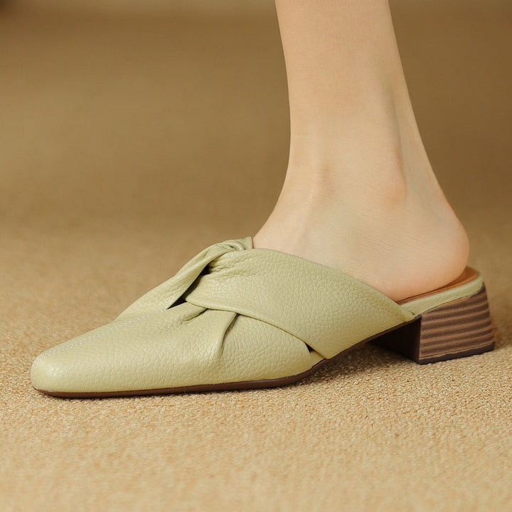 Mules en cuir à nœud papillon