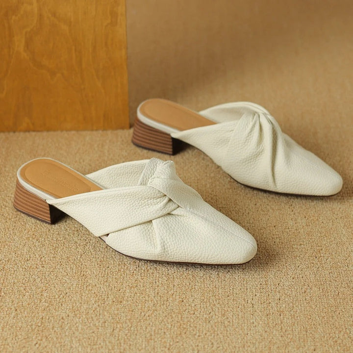 Mules en cuir à nœud papillon